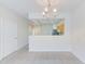 Bright dining room features tile floors and a view into the kitchen at 26519 Castleview Way, Wesley Chapel, FL 33544
