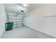 Attached garage with overhead door and ample storage space at 26519 Castleview Way, Wesley Chapel, FL 33544
