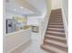Kitchen features light wood cabinets, stainless steel appliances, and tile flooring at 26519 Castleview Way, Wesley Chapel, FL 33544
