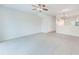Spacious living room with tile flooring and ceiling fan at 26519 Castleview Way, Wesley Chapel, FL 33544