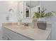 White bathroom vanity with beige countertop and decorative vase at 2736 Haverhill Ct # 2736, Clearwater, FL 33761