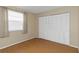 Bedroom with wood floors, window with blinds, and large closet at 2736 Haverhill Ct # 2736, Clearwater, FL 33761