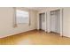 Well-lit bedroom with large closet and wood flooring at 2736 Haverhill Ct # 2736, Clearwater, FL 33761