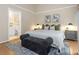 Main bedroom with king-size bed and ensuite bathroom at 2736 Haverhill Ct # 2736, Clearwater, FL 33761