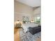 King-size bed in bright bedroom with hardwood floors at 2736 Haverhill Ct # 2736, Clearwater, FL 33761