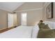 King-size bed with ensuite bathroom and access to hallway at 2736 Haverhill Ct # 2736, Clearwater, FL 33761