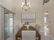 Bright dining room with wood table, chandelier, and access to a patio at 2736 Haverhill Ct # 2736, Clearwater, FL 33761