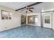Enclosed patio with tile floor, sliding glass doors, and ceiling fan at 2736 Haverhill Ct # 2736, Clearwater, FL 33761