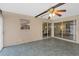 Spacious enclosed patio with tile floors, ceiling fan, and views of living room at 2736 Haverhill Ct # 2736, Clearwater, FL 33761