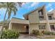 Inviting exterior of a contemporary townhome with a carport and landscaping at 2736 Haverhill Ct # 2736, Clearwater, FL 33761