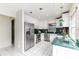 Clean kitchen with white cabinets, stainless steel appliances, and green countertops at 2736 Haverhill Ct # 2736, Clearwater, FL 33761