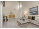 Two-story living room with high ceilings, featuring a sofa and coffee table at 2736 Haverhill Ct # 2736, Clearwater, FL 33761