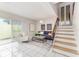 Modern living room with a comfortable sofa and access to a patio at 2736 Haverhill Ct # 2736, Clearwater, FL 33761