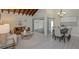 Bright living room features a leather sofa, coffee table, and access to a patio at 2736 Haverhill Ct # 2736, Clearwater, FL 33761