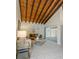Living area boasts high ceilings with wood beams, adding warmth and character at 2736 Haverhill Ct # 2736, Clearwater, FL 33761