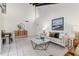 Spacious living room with high ceilings, exposed beams, and tiled floors at 2736 Haverhill Ct # 2736, Clearwater, FL 33761