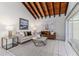Living room with high ceilings, wood beams, and comfortable seating at 2736 Haverhill Ct # 2736, Clearwater, FL 33761