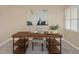 Home office features a rustic wood desk and plenty of natural light at 2736 Haverhill Ct # 2736, Clearwater, FL 33761