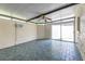 Bright sunroom with tile flooring, ceiling fan, and sliding glass doors at 2736 Haverhill Ct # 2736, Clearwater, FL 33761