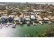 Aerial view of waterfront home with private pool and boat dock at 316 16Th Ave, Indian Rocks Beach, FL 33785