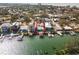 Aerial view showcasing a canal-front house with a pool and dock at 316 16Th Ave, Indian Rocks Beach, FL 33785