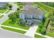 Two-story house, gray roof, light blue walls, landscaping, and driveway at 3238 Mela Ct, Holiday, FL 34691