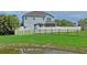 House with a large backyard and pond at 3238 Mela Ct, Holiday, FL 34691