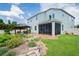 Landscaped backyard with stone path and pond at 3238 Mela Ct, Holiday, FL 34691