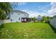 Spacious backyard with lush lawn and gazebo at 3238 Mela Ct, Holiday, FL 34691
