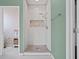 Spa-like bathroom with a herringbone tiled shower at 3238 Mela Ct, Holiday, FL 34691