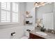 A well-appointed bathroom boasts a granite vanity and updated fixtures at 3238 Mela Ct, Holiday, FL 34691