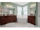 Spa-like bathroom with soaking tub and double vanity at 3238 Mela Ct, Holiday, FL 34691