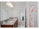 Double vanity bathroom with granite countertops at 3238 Mela Ct, Holiday, FL 34691