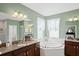 Spa-like bathroom with soaking tub and double vanity at 3238 Mela Ct, Holiday, FL 34691