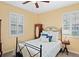 Bright bedroom with double window and ceiling fan at 3238 Mela Ct, Holiday, FL 34691