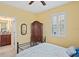Bedroom with ensuite bathroom access and wooden cabinet at 3238 Mela Ct, Holiday, FL 34691