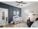 Bedroom with crib, rocker, and ample storage at 3238 Mela Ct, Holiday, FL 34691