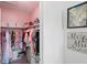 Large walk-in closet with ample hanging space and shelving at 3238 Mela Ct, Holiday, FL 34691