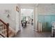 Bright and spacious entryway with view through to the living room and Gathering room at 3238 Mela Ct, Holiday, FL 34691