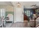 Bright entryway with decorative wallpaper, bench, and an office area at 3238 Mela Ct, Holiday, FL 34691