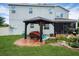 Relaxing gazebo with patio and pond view at 3238 Mela Ct, Holiday, FL 34691