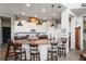 Modern kitchen with white cabinets, granite counters, and an island at 3238 Mela Ct, Holiday, FL 34691