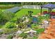 Koi pond with lush landscaping and stone accents at 3238 Mela Ct, Holiday, FL 34691