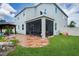 Spacious patio with screened enclosure and landscaping at 3238 Mela Ct, Holiday, FL 34691