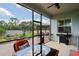 Outdoor kitchen and dining area on the porch at 3238 Mela Ct, Holiday, FL 34691