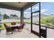 Relaxing screened porch with outdoor seating at 3238 Mela Ct, Holiday, FL 34691