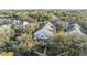 Aerial view of community with lake, pool, and lush landscaping at 3270 Haviland Ct # 304, Palm Harbor, FL 34684