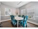 Bright community room with table and chairs for meetings or gatherings at 3270 Haviland Ct # 304, Palm Harbor, FL 34684