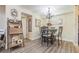 Bright dining room features a chandelier and table with four chairs at 3270 Haviland Ct # 304, Palm Harbor, FL 34684