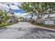 Community entrance with stonework and gated entry at 3270 Haviland Ct # 304, Palm Harbor, FL 34684